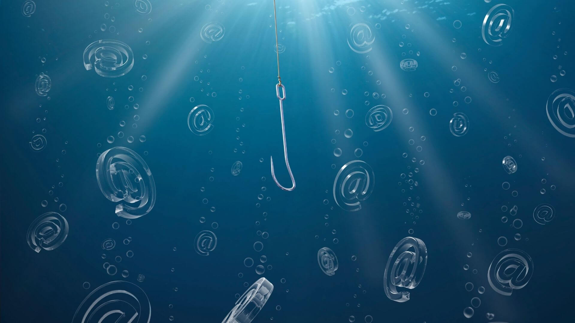 Blue underwater scene of a phishing hook trying to catch “@” signs, symbolizing email phishing.